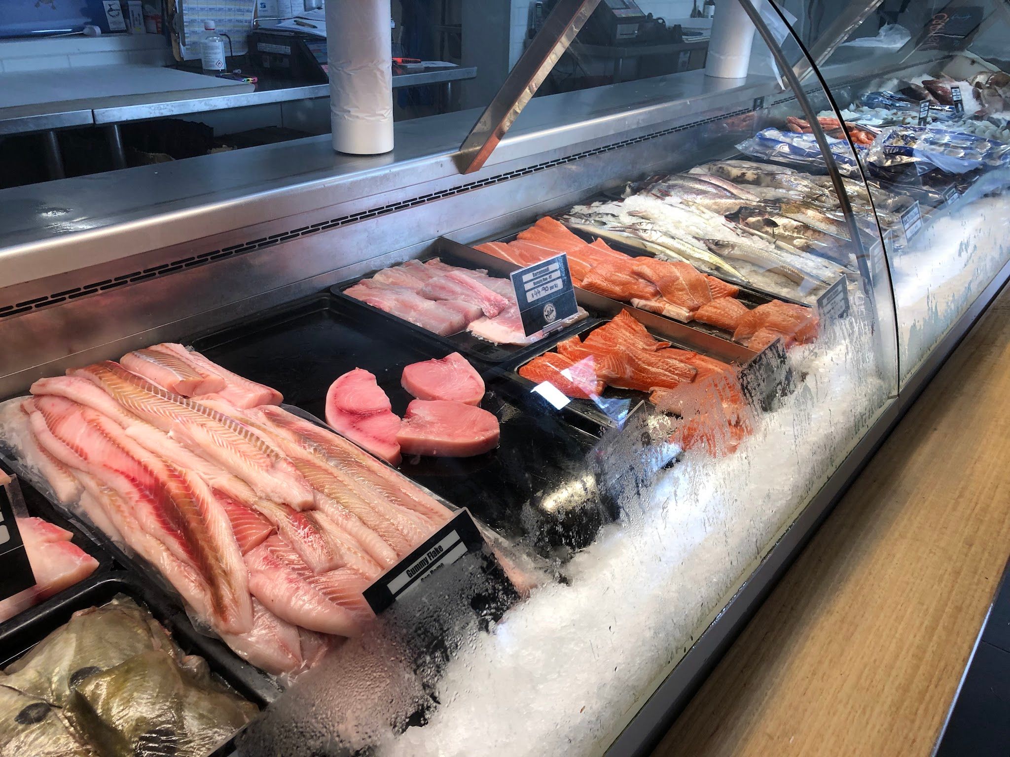 Wide view of Bass Strait Direct seafood display counter fully stocked with fresh fish and fillets