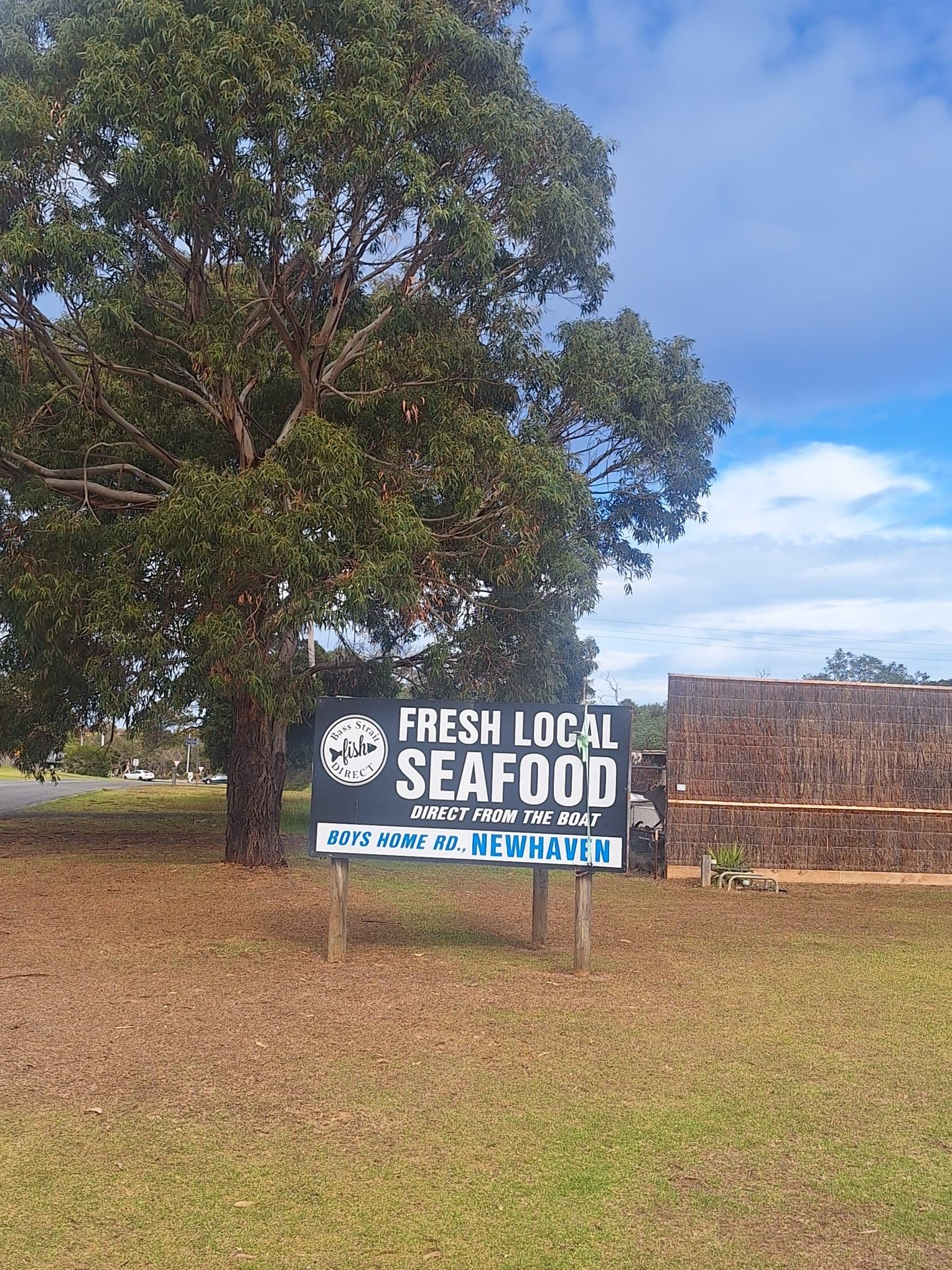 Bass Strait Direct roadside sign at Newhaven with fresh local seafood messaging